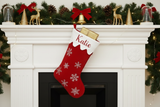 Christmas stocking on white fireplace mantle
